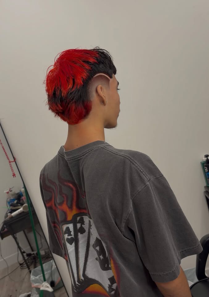 Full-length view of the red and black mullet cut